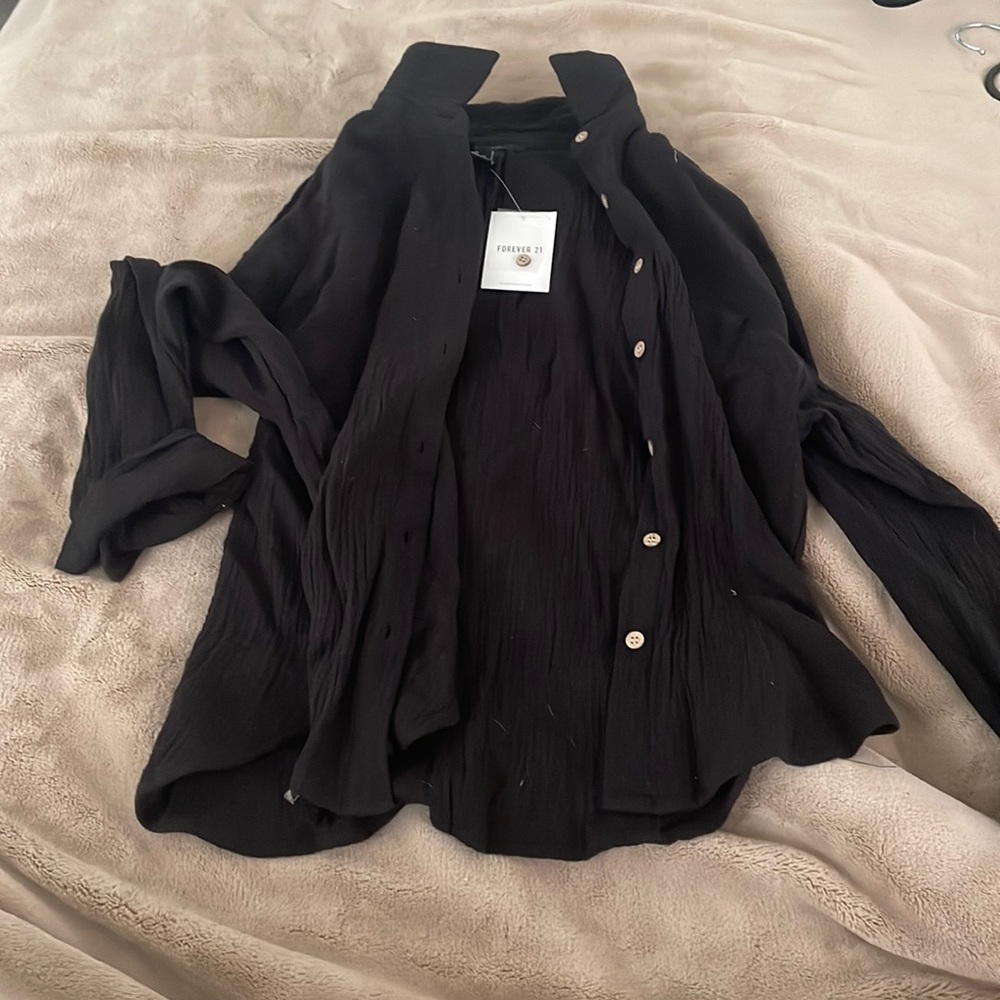 Women’s black button up.